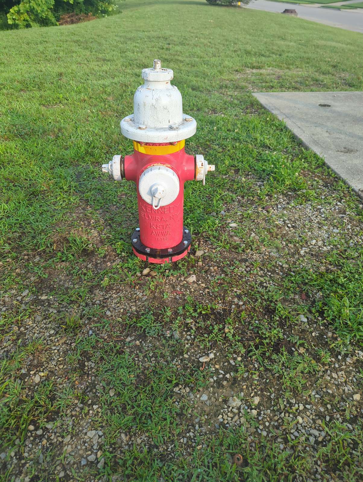 Kennedy K81A private fire hydrant painted red and white